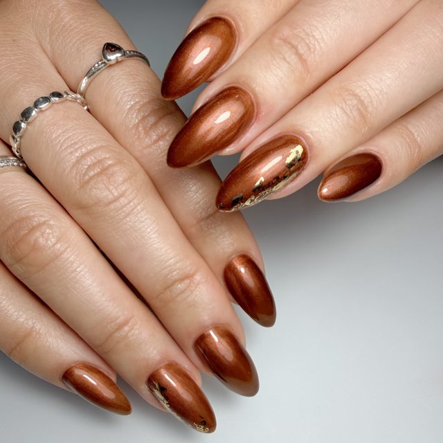 Bronze chrome almond nails by The Nail Editor