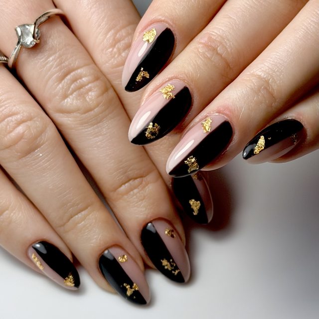 Black and nude diagonal nails with gold leaf detail by The Nail Editor