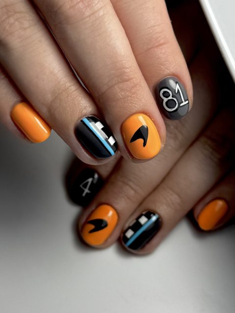 McLaren Formula 1 inspired nail art in papaya and black by The Nail Editor