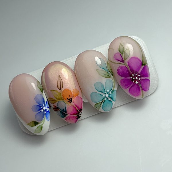 Hand-painted 3D floral nail art on display tips by The Nail Editor