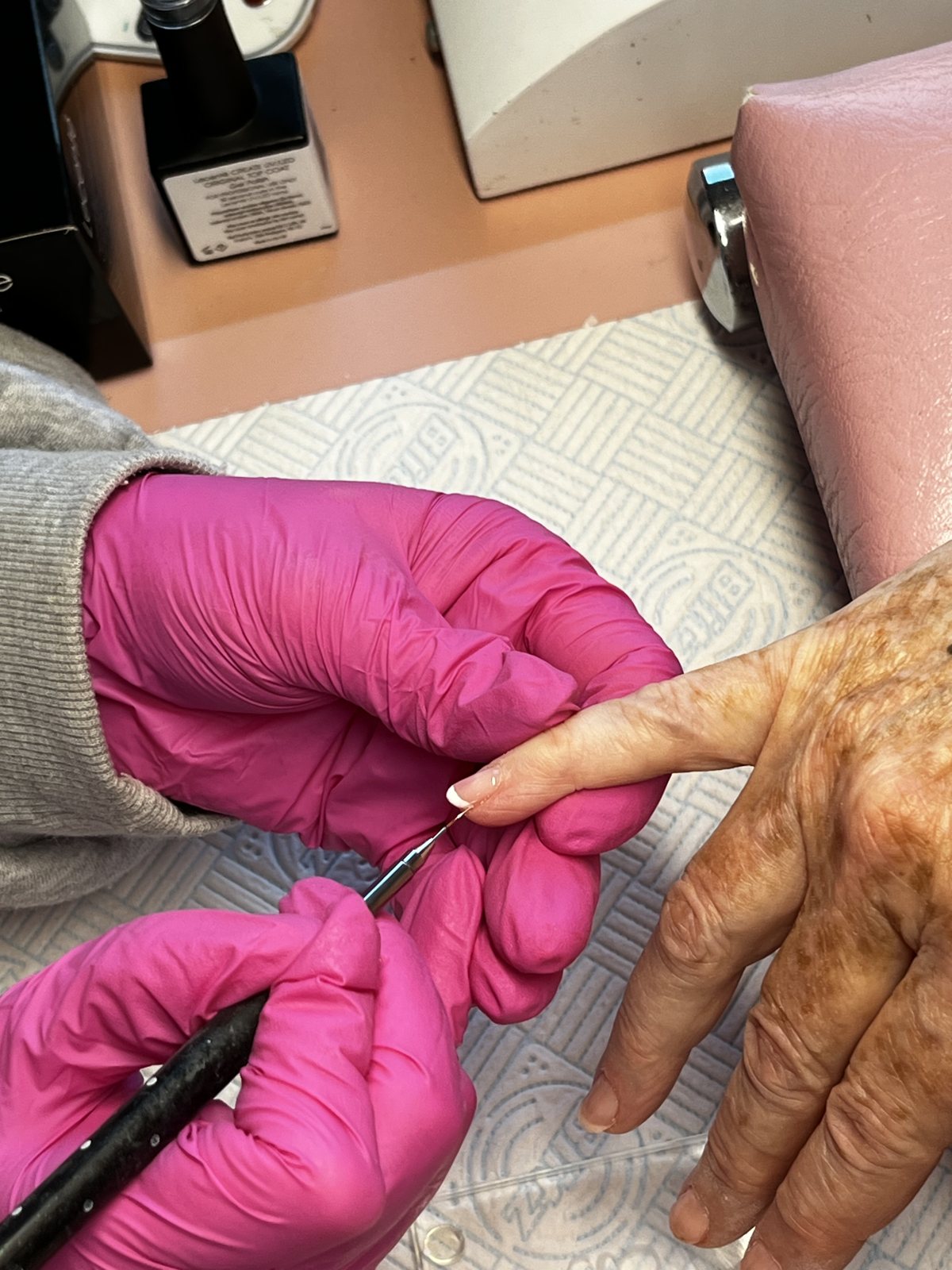 Nail technician at work